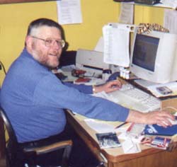 Br. Elias at the computer terminal.